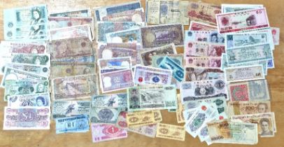 A group of assorted world banknotes.