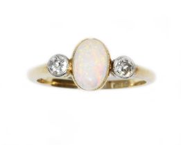 An antique opal and diamond ring, the oval opal cabochon measuring approximately 8.05mm x 5.80mm,
