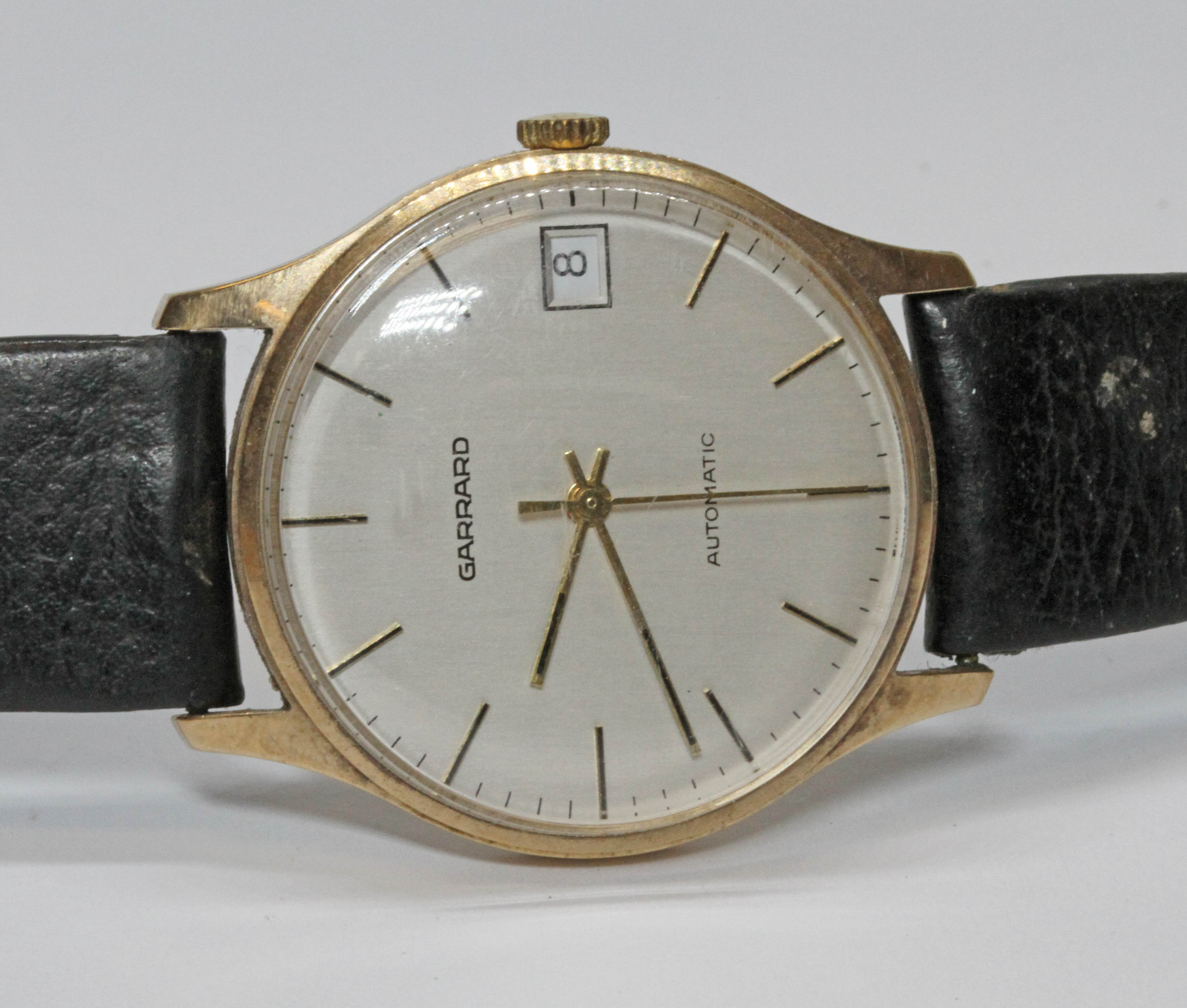 A Garrard 9ct gold automatic wristwatch, case diameter 33mm, later leather strap.