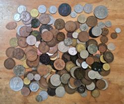 A tub of assorted GB & world coins to include a George III cartwheel penny, 1972 US dollar &...