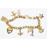 An Italian 9ct gold charm bracelet, international convention marks, length 18cm, gross wt. 9.7g.