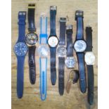 A group of seven assorted Swatch watches and another.