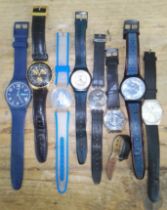 A group of seven assorted Swatch watches and another.
