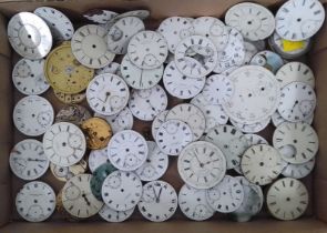 A box of assorted pocket watch movements and dials.