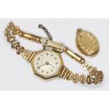 A ladies 9ct gold Frey wristwatch with rolled gold strap, together with a yellow metal locket.