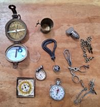 A mixed lot including a ladies silver pocket watch, a Negretti & Zambra pocket forecaster, a.....