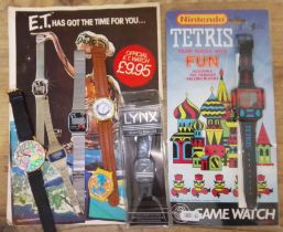 A mixed lot of novelty watches including Nintendo Tetris watch, ET watch, Lynx watch, Dinosaur