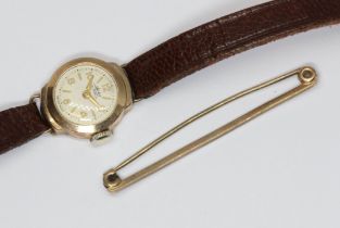 A ladies 9ct gold Avia wristwatch with leather strap and a bar brooch marked '9ct'.