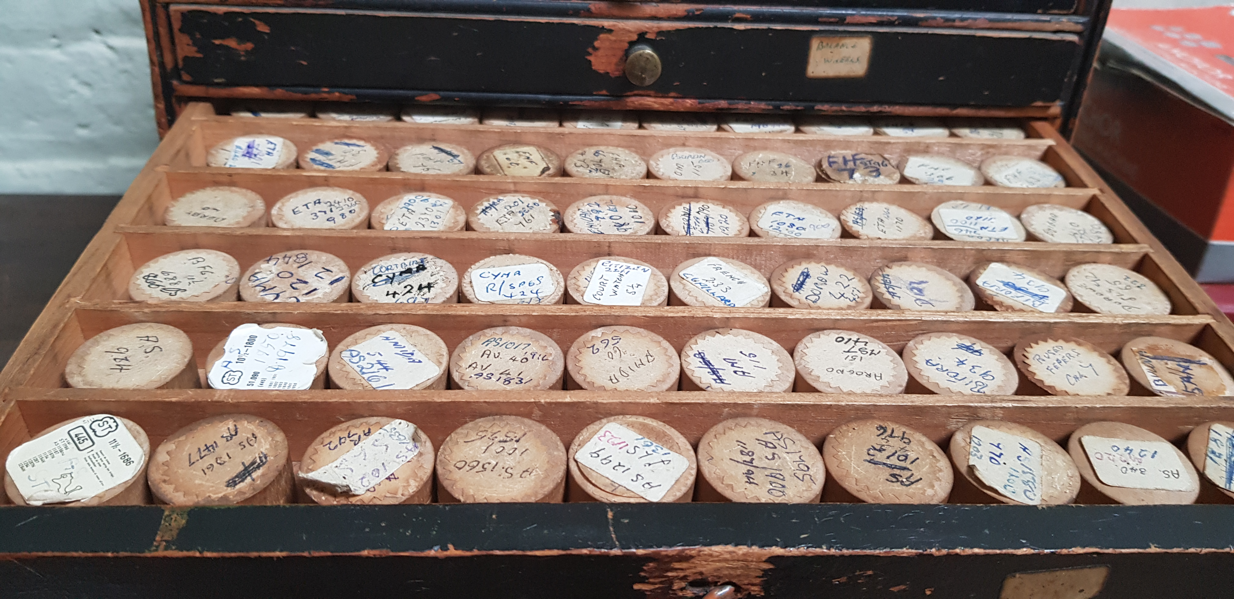 A cabinet of assorted watch spares. - Image 4 of 7