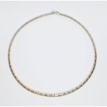 A smooth three colour choker necklace, marked '14KT', length 41cm, weight 21.6g. Condition -