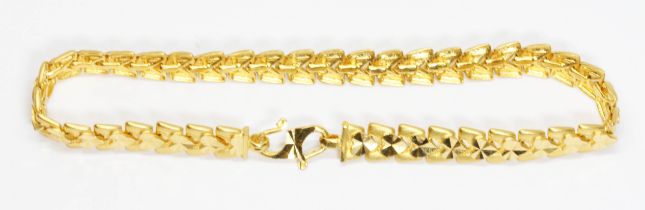 A Singaporean bracelet by Luvenus, trapazoid and love heart links, s hook clasp, marked '916',