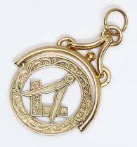 A Masonic swivel pendant, marked '9ct', length 30mm, weight 3.2g. Condition - good, general wear.