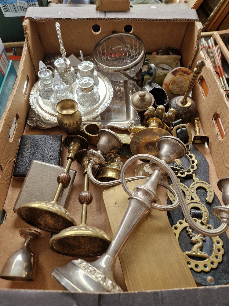 A box of assorted metalware.