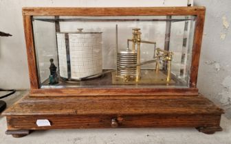 A Short & Mason weather station/barometer, on plynth with drawer & in display case.