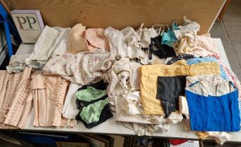 A box of vintage fashion comprising 1950s/60s under wear, nighties, stockings etc.