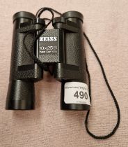 A pair of Zeiss 10x25B pocket binoculars.