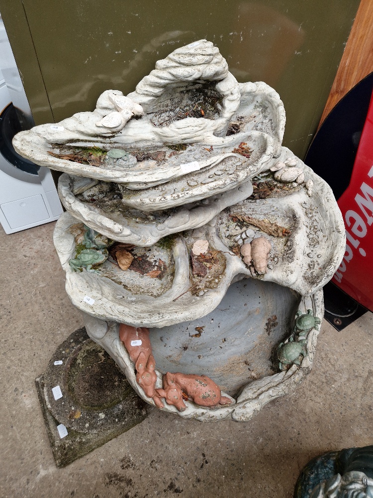 A stoneware garden water feature.