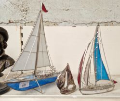 Three metal ship models, two with coloured glass sails