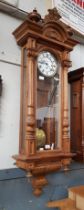 A walnut cased triple weight Vienna clock.