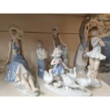 A group of six Lladro, Nao and similar figures.