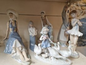 A group of six Lladro, Nao and similar figures.