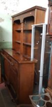 A Mahogany bar with shelving unit and glass display cabinet