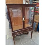 A mahogany display cabinet.