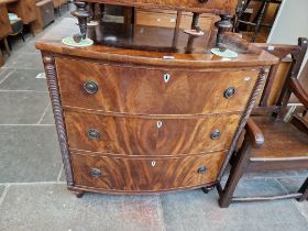 A Regency mahogany bow front chest of drawers, later handles.