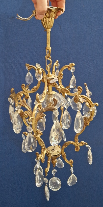 A vintage French chandelier with glass droppers.