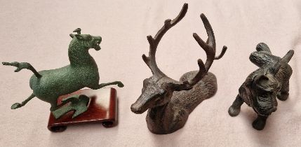 A cast iron doorstop modelled as a dog, cast iron bottle holder and a Chinese 'Flying Horse' metal