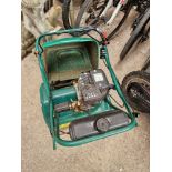 A Qualcast 35S petrol lawnmower.