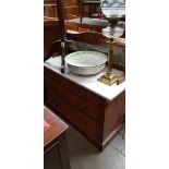 An Edwardian Arts & Crafts walnut washstand together with a Royal Doulton washstand bowl.