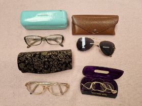 Four pairs of vintage glasses.