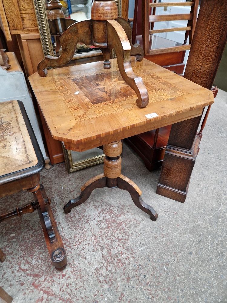 A Victorian parquetry inlaid walnut pedestal table.