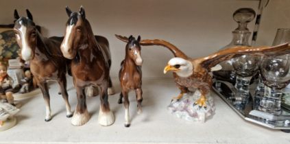 Four Beswick horses and a Beswick eagle.