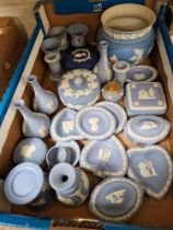 A box of blue and white Wedgwood jasperware.
