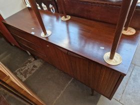 A mid 20th century teak sideboard