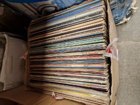 A box of assorted LPs.
