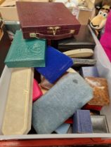 A box of antique, vintage and modern jewellery boxes.