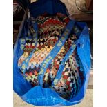 A bag of knitted woolen blankets.