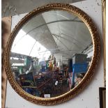 A vintage gilt framed convex mirror, 67.5cm diameter (overall).