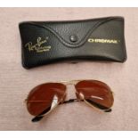 A pair of Ray-Ban Driving Series Chromax sun glasses.