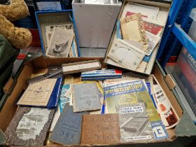 A box of mixed collectables including football and Rugby League programmes, postcards, RAF 1946