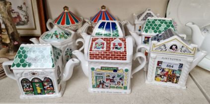 9 novelty teapots - 7 Wade ‘English Life Teapots’ together with 2 from the ‘Edwardian