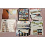 A box of mint stamps including Royal Mail Presentation Packs etc.