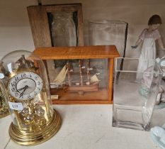 Three glass vases, ship in a case and a revolving penedulum clock