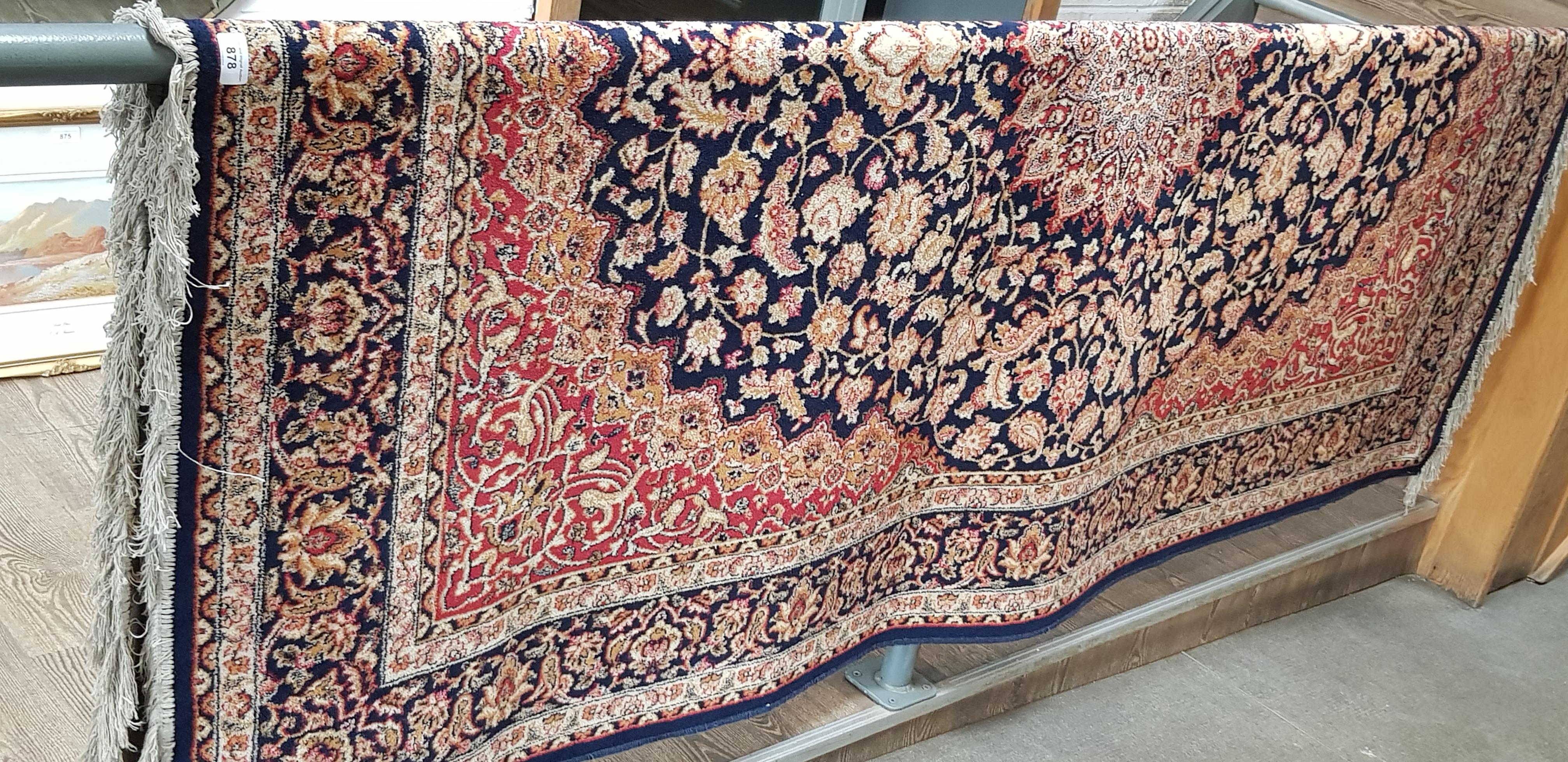 An Eastern Keshan style carpet, blue ground with floral design, 240cm x 160cm (approx).