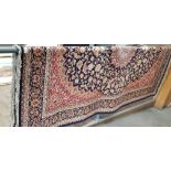 An Eastern Keshan style carpet, blue ground with floral design, 240cm x 160cm (approx).