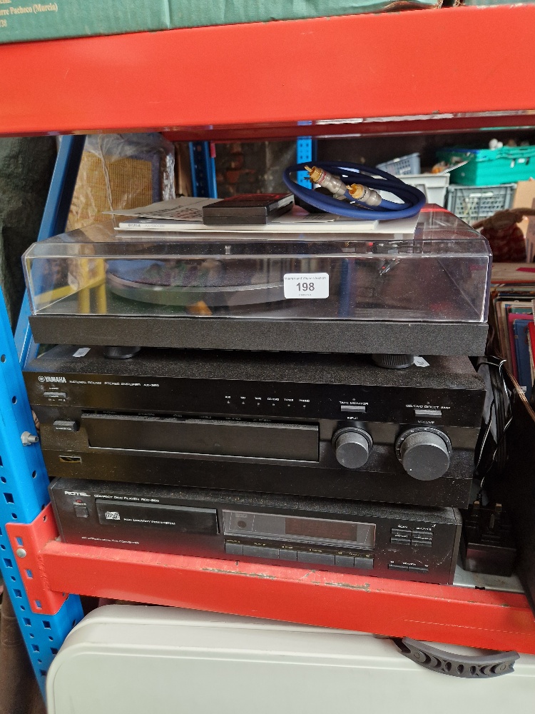 A Project turntable, a Rotel CD player and a Yamaha stereo amplifier together with two Mordaunt