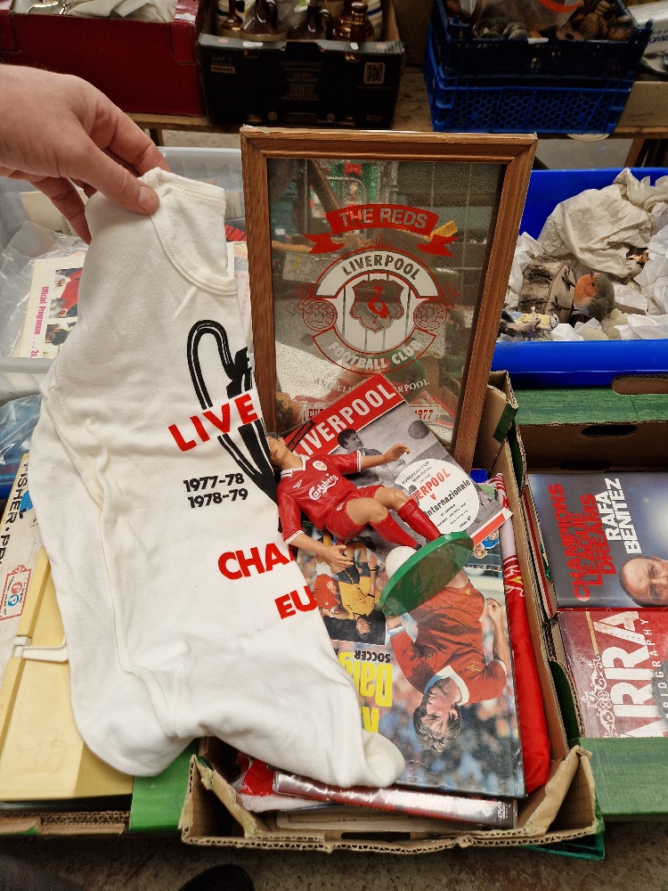 A box of Liverpool FCmemorabilia to include t-shirt, flags, figure, mirror, annuals, dvds, vhs...